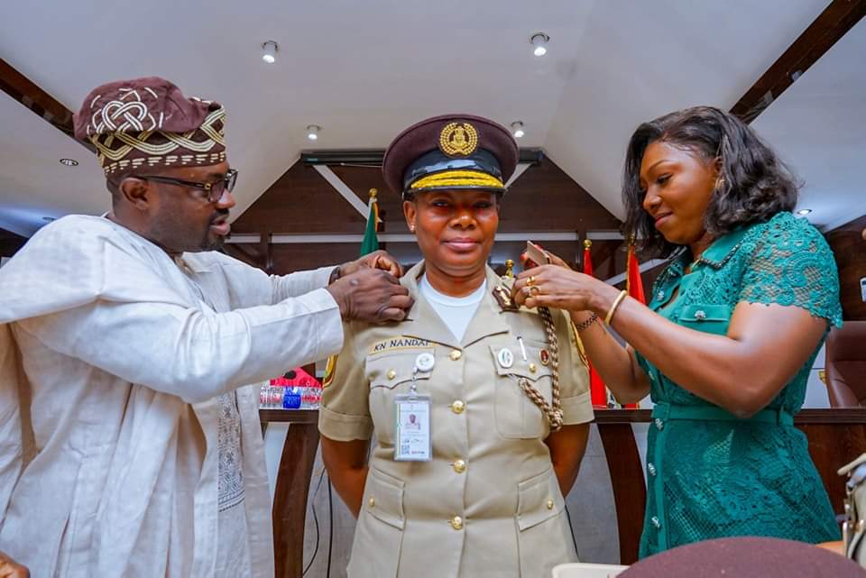 Minister of Interior decorates Kemi Nanna Nandap as the 19th Comptroller General of the Nigeria Immigration Service.