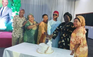Emmanuel Ogbeche celebrating with friends and family