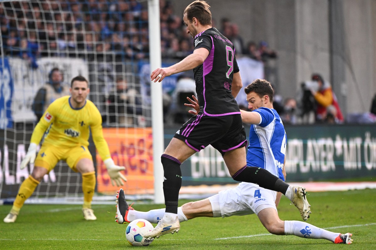 Bayern Munich’s English forward #09 Harry Kane gets through on goal during the German first division Bundesliga football match between SV Darmstadt 98 and FC Bayern Munich in Darmstadt, western Germany on March 16, 2024. (Photo by Kirill KUDRYAVTSEV / AFP)