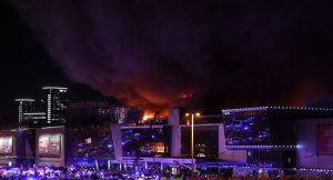 A view shows the burning Crocus City Hall concert hall following the shooting incident in Krasnogorsk, outside Moscow, on March 22, 2024. (Photo by STRINGER / AFP)