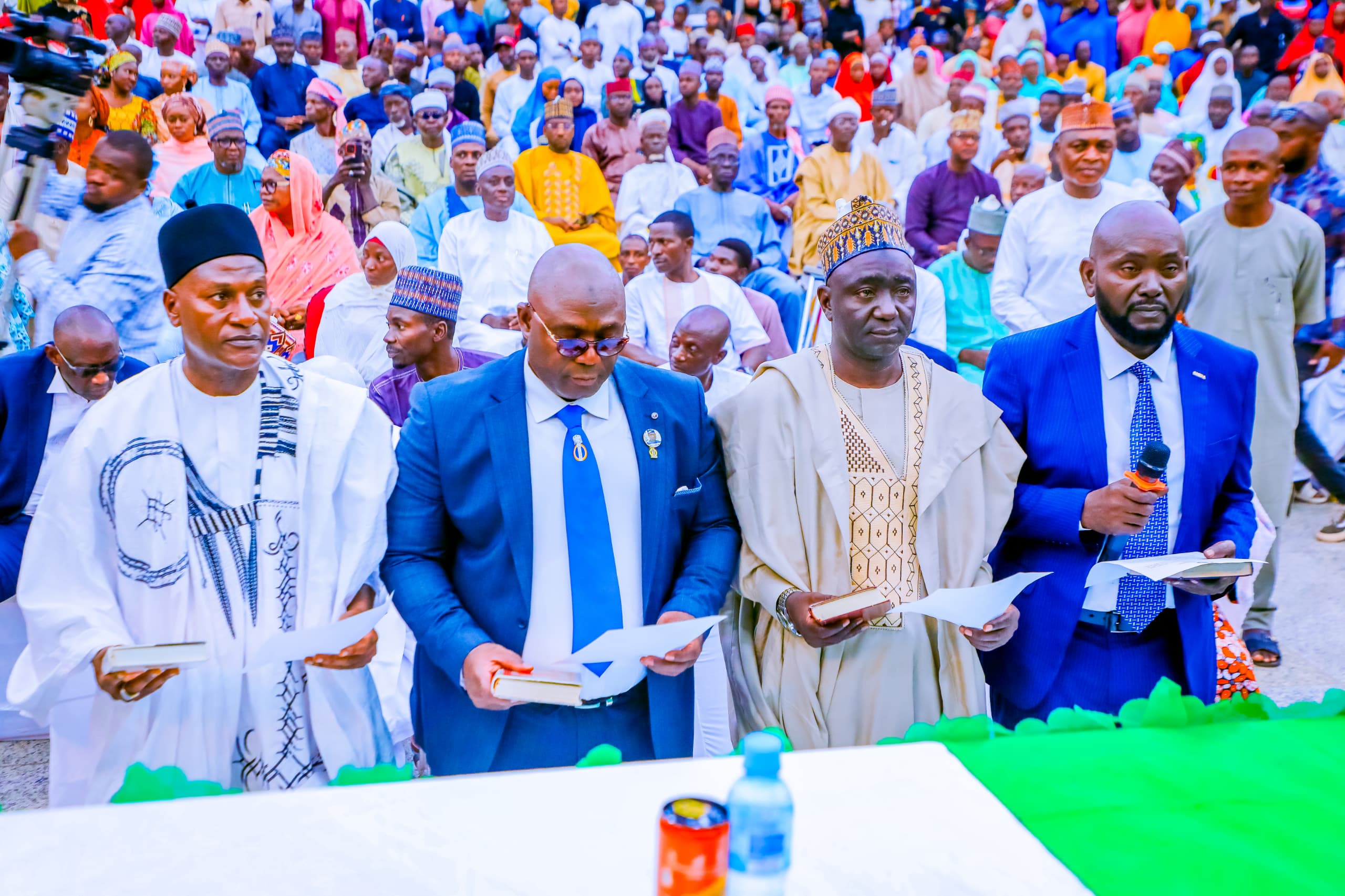 First picture is the newly sworn in chairman of the disability commission in Nasarawa State, Sale Barde Keana, on wheel chair, while seated on his front are the new permanent secretaries.
