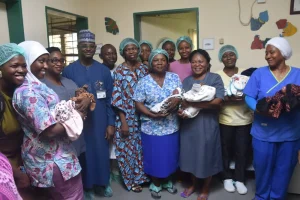The CMD, National Hospital, Prof. Muhammad Mahmud, the parents of the sextuplets, Mr Ifeanyi and Mrs Precious Nwachukwu and hospital staff with the sextuplets, on Thursday in Abuja