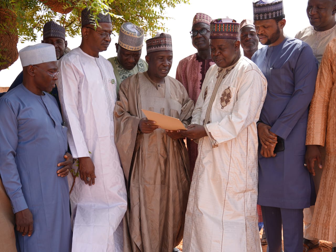 Third from left, Permanent Secretary, Cabinet Office; Alh Dahiru Zaki, handing over the documents of the 10 Hectares of land meant for the establishment of the Agricultural Machinery and Equipment Development Institute (AMEDI) to NASENI's Director of Procurement, Dr Mohammad Mohammed who represented the EVC/CEO, Mr Khalil Suleiman Halilu in Birnin Kebbi, Kebbi State on Wednesday 17th April, 2024.
