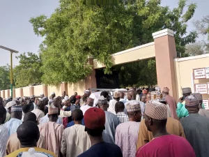 Crowd trooping into Maiduguri cemetery for the burial of Ciroma, on Wednesday.