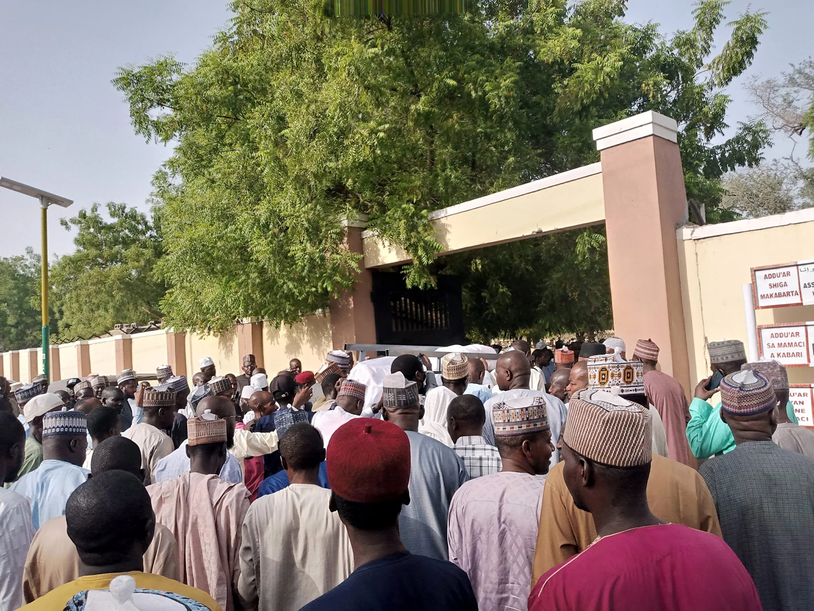 Crowd trooping into Maiduguri cemetery for the burial of Ciroma, on Wednesday.