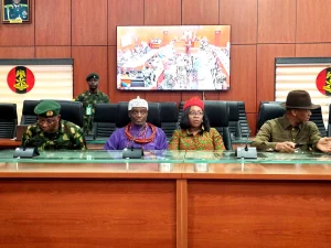 The Director, Army Public Relations, Maj.-Gen. Onyema Nwachukwu handing over the Traditional Ruler of Ewu Kingdom, HRH Clement Ikolo, who was detained in connection to killing of Army Personnel in Okuama Community in Delta, to the Senator Representing Delta Central, Sen. Ede Dafinone in Abuja on Friday (19/4/24)