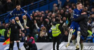 Chelsea’s English midfielder #20 Cole Palmer (2nd R) celebrates with teammates after scoring the fourth and winning goal of his team during the English Premier League football match between Chelsea and Manchester United at Stamford Bridge in London on April 4, 2024. (Photo by Glyn KIRK / AFP)
