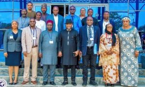 Acting Director General of Civil Aviation (Ag. DGCA), Capt. Chris Ona Najomo.in a group photograph with the NCAA Project Monitoring and Evaluation committee members
