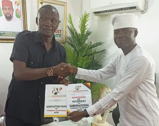 Mr William Moses, National Organising Secretary , Young Progressives Party (YPP) presenting Nomination and Expression of Interest Forms to Mr John Akinmurele in Abuja