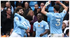 Manchester City’s Croatian defender #24 Josko Gvardiol (L) celebrates with teammates after scoring their fifth goal during the English Premier League football match between Manchester City and Luton Town at the Etihad Stadium in Manchester, north west England, on April 13, 2024. (Photo by Darren Staples / AFP)