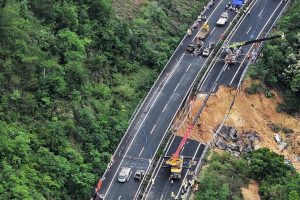 A section of a highway collapsed early Wednesday in southern China leaving more than a dozen of people dead, local officials said, after the area had experienced heavy rain in recent days. (Xinhua News Agency via AP)