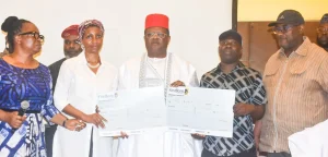 Pic from left, Controller of Works Lagos, Mrs Olukorede Kasha; one of the beneficiaries, Kemi Osinibi; Minister of Works, David Umahi; another beneficiary, Peters Oladipupo and Director Highway Bridges & Design, Mr Bede Obioha during the payment of compensation to the affected property owner on the Lagos-Calabar Highway construction in Lagos on Wednesday (01/05/24)