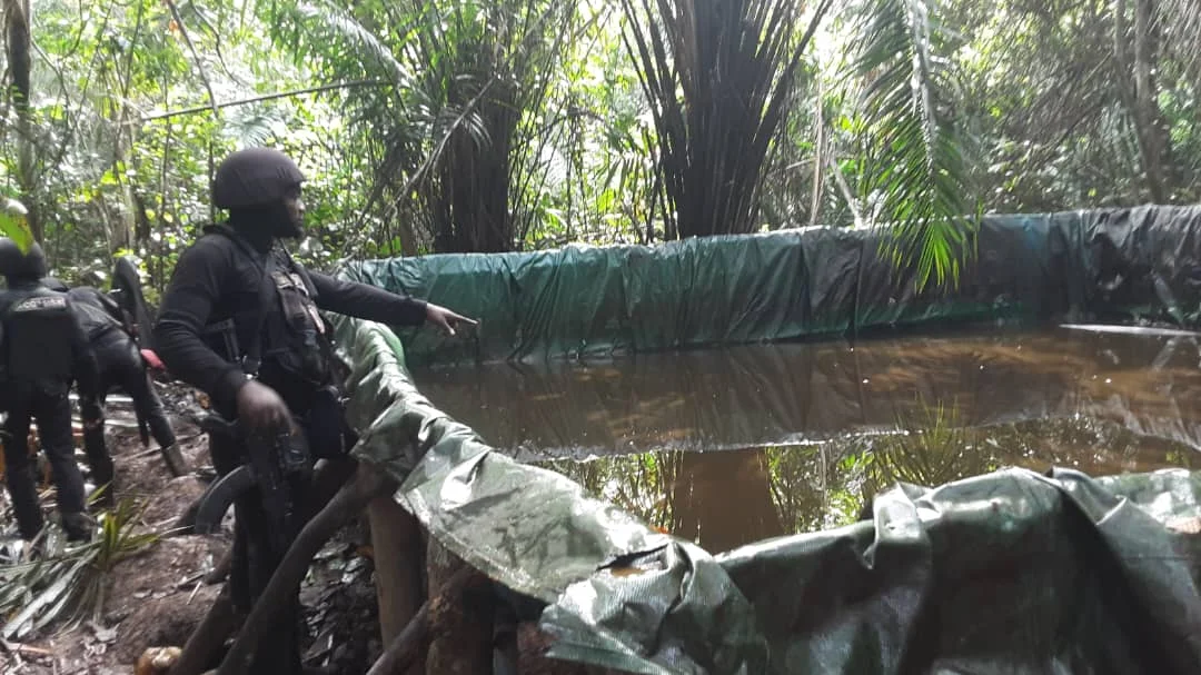 NSCDC operatives at an uncovered illegal oil site