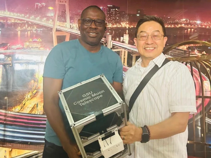 Prof Babatunde Rabiu, Director, UN-ARCSSTE-E and Prof. He Xiaochun, Georgia State University, with the Cosmic Ray Muon Detector