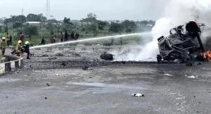 Fire fighters putting out an flames from a petrol laden tanker explosion at Obiri Ikwerre flyover in Port Harcourt on Tuesday 1