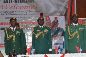 From the left Maj.-Gen. Mayirenso Saraso, GOC 1 Division, middle the Commandant, Warrant Officer Academy, Brig.-Gen. Auwal Mahmuda at the academy’s graduation on Friday in Kaduna