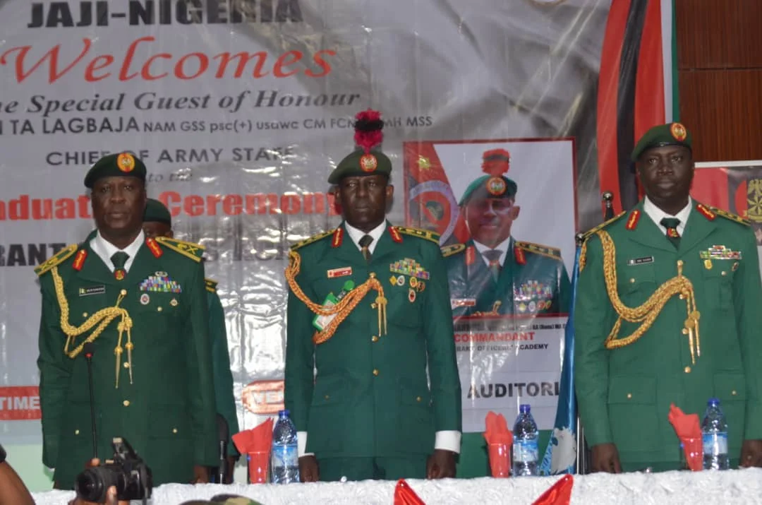 From the left Maj.-Gen. Mayirenso Saraso, GOC 1 Division, middle the Commandant, Warrant Officer Academy, Brig.-Gen. Auwal Mahmuda at the academy’s graduation on Friday in Kaduna