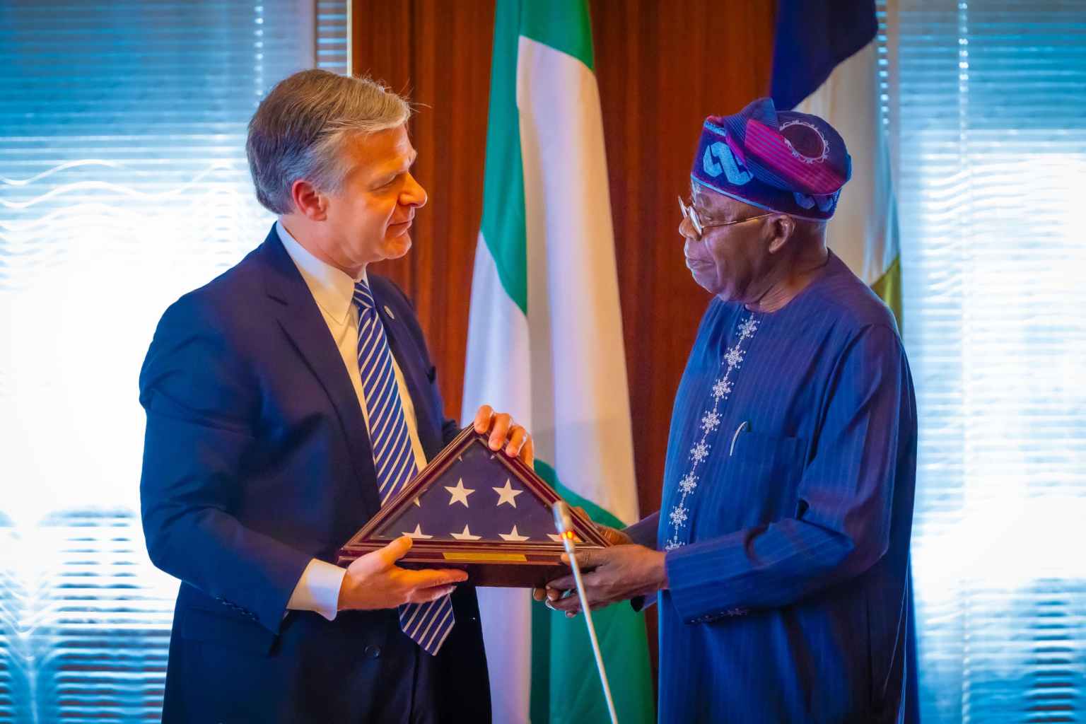 President Bola Tinubu and the FBI director, Christopher Asher Wray, during a courtesy visit at the State House in Abuja.