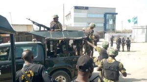 Security operatives at the scene of the bank robbery