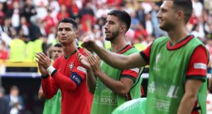 Portugal’s forward #07 Cristiano Ronaldo (L) celebrates after winning the UEFA Euro 2024 Group F football match between Turkey and Portugal at the BVB Stadion in Dortmund on June 22, 2024. (Photo by FRANCK FIFE / AFP)