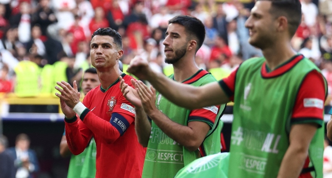 Portugal’s forward #07 Cristiano Ronaldo (L) celebrates after winning the UEFA Euro 2024 Group F football match between Turkey and Portugal at the BVB Stadion in Dortmund on June 22, 2024. (Photo by FRANCK FIFE / AFP)