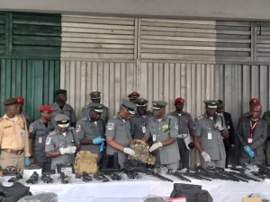 The Comptroller General of Customs, Bashir Adeniyi, with Zonal coordinator Zone ‘A’ Assist Comptroller General, Saidu Yusuf, during interception of arms and ammunition at Lagos airport on Wednesday