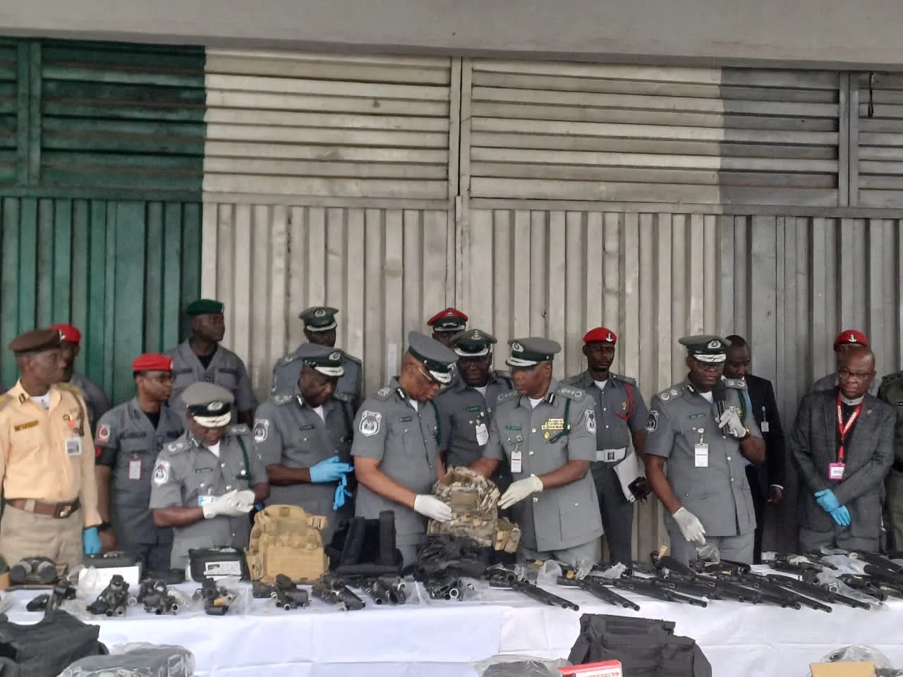 The Comptroller General of Customs, Bashir Adeniyi, with Zonal coordinator Zone ‘A’ Assist Comptroller General, Saidu Yusuf, during interception of arms and ammunition at Lagos airport on Wednesday