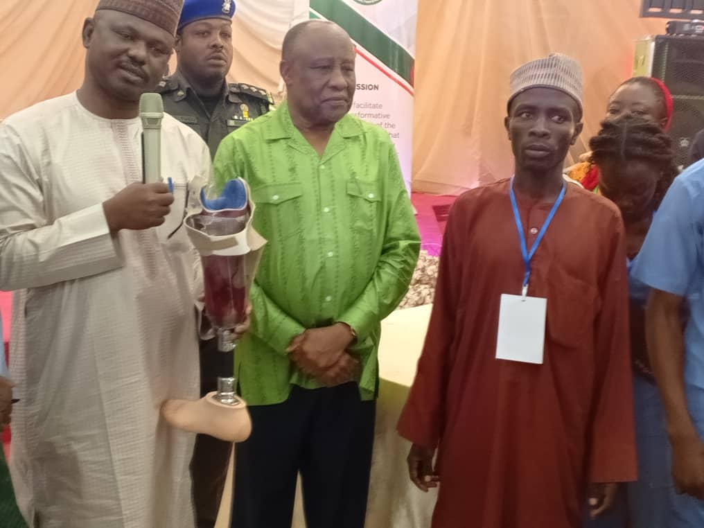 The Executive Secretary, National Commission for Persons with Disabilities, Mr. James Lalu, and the NEDC's Managing Director/CEO, Ambassador Goni Mohammed Alkali, during the symbolic distribution and presentation of assistive devices to persons with disabilities in Borno State.