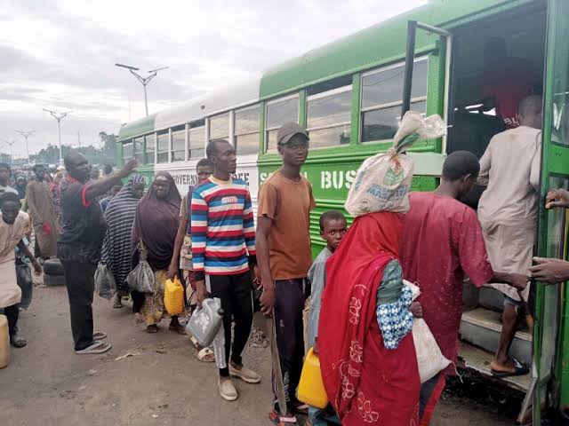 Farmers in Maiduguri boarding free buses provided by Borno Government to convey them to their farms located at the outskirts of the town .