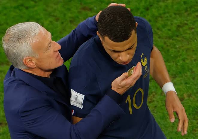 French striker Kylian Mbappe and coach Didier Deschamps