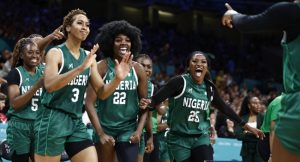 Nigeria’s #05 Olaoluwatomi Oluwayemisi Taiwo, Nigeria’s #03 Pallas Kunaiyi-Akpanah, Nigeria’s #22 Blessing Ejiofor and Nigeria’s #25 Adebola Adeyeye celebrate after Nigeria completed the third quarter ahead of Canada in the women’s preliminary round group B basketball match