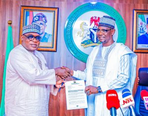 Governor Sule of Nasarawa recieving letter from Engr. Obadiah Simon Nkom, representative of Minister of Solid Minerals Development, Dr. Dele Alake, during a courtesy call on the Governor, at Government House, on Friday.