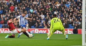 Brighton’s English midfielder #06 James Milner (C) fails to connect with the ball during the English Premier League football match between Brighton and Hove Albion and Manchester United at the American Express Community Stadium in Brighton, southern England on August 24, 2024. (Photo by Glyn KIRK / AFP) /