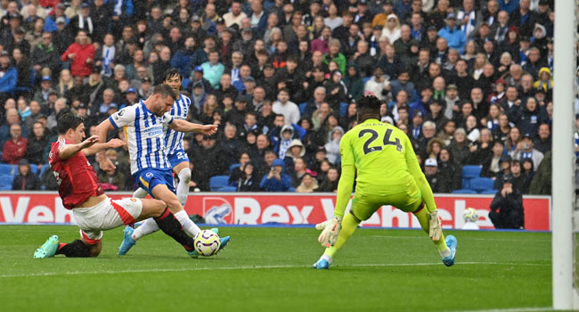 Brighton’s English midfielder #06 James Milner (C) fails to connect with the ball during the English Premier League football match between Brighton and Hove Albion and Manchester United at the American Express Community Stadium in Brighton, southern England on August 24, 2024. (Photo by Glyn KIRK / AFP) /