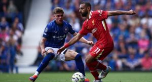 Liverpool’s Egyptian striker #11 Mohamed Salah (R) fights for the ball with Ipswich Town’s English defender #03 Leif Davis during the English Premier League football match between Ipswich Town and Liverpool at Portman Road in Ipswich, eastern England on August 17, 2024. (Photo by HENRY NICHOLLS / AFP)