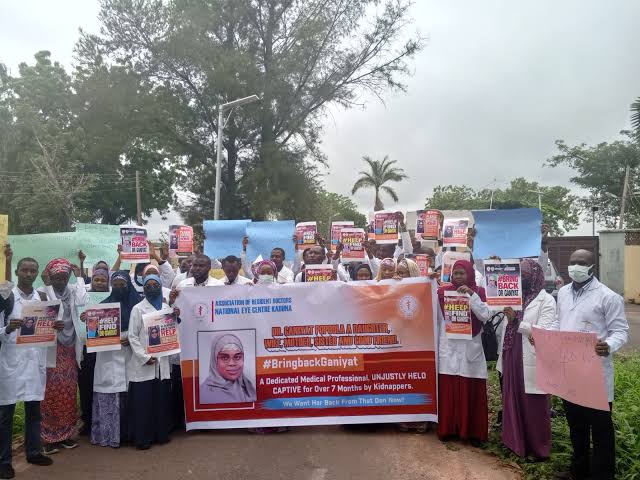 The doctors with placards demanding the release of a colleague