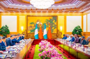 President Tinubu and members of his delegation (right) and Chinese officials and investors in Beijing
