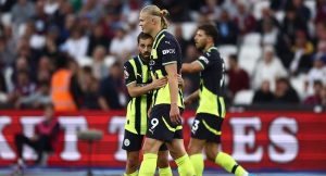 Manchester City’s Norwegian striker Erling Haaland celebrates after scoring his third goal during the match against West Ham United at the London Stadium, in London on August 31, 2024. (Photo by HENRY NICHOLLS / AFP)
