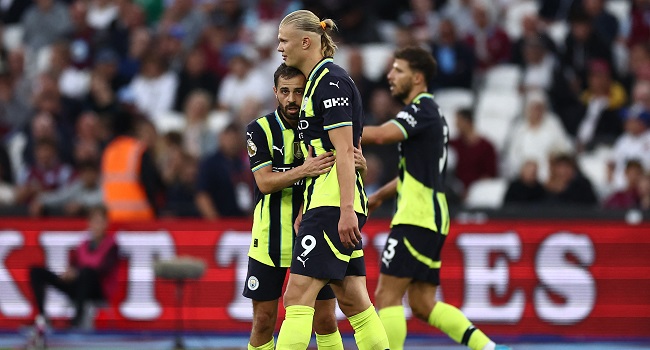 Manchester City’s Norwegian striker Erling Haaland celebrates after scoring his third goal during the match against West Ham United at the London Stadium, in London on August 31, 2024. (Photo by HENRY NICHOLLS / AFP)