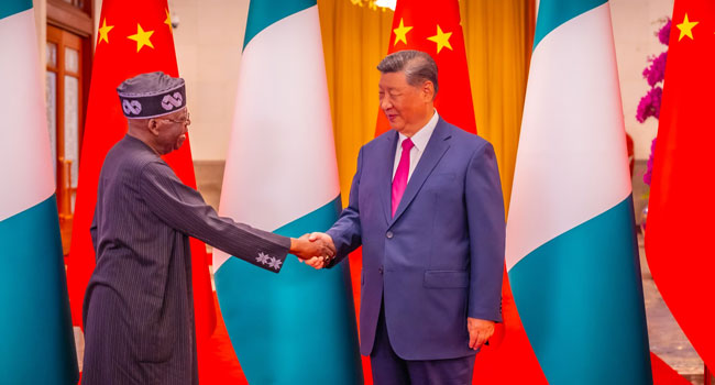 President Bola Tinubu greets his Chinese counterpart, Xi Jinping, in Beijing, China on September 3, 2024