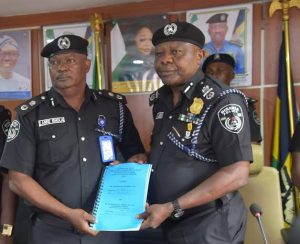 AIG Adegoke Fayoade (2nd R) handing over to the new CP in Lagos command, Mr Olanrewaju Ishola on Tuesday at Command’s headquarters Ikeja (NAN)