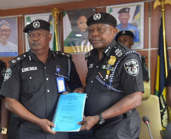 AIG Adegoke Fayoade (2nd R) handing over to the new CP in Lagos command, Mr Olanrewaju Ishola on Tuesday at Command’s headquarters Ikeja (NAN)