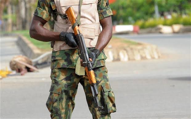 A Nigerian soldier holding a rifle
