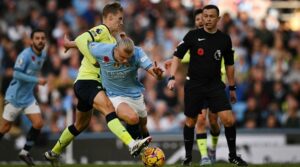 Flynn Downes 2nd L tackles Manchester Citys Norwegian striker 09 Erling Haaland TopshotFblEngPrManCitySouthampton 1