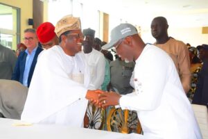 Umahi exchanging pleasantries with Gov. Aiyedatiwa.