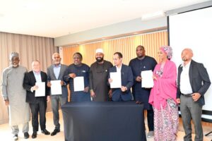 Gov. Muhammed Bago of Niger, Amb. Yusuf Tuggar, Minister of Foreign Affairs, officials of Niger Foods and Uttam Sucrotech International Ltd., after signing the $5 billion MoU on Nov. 20 in Rio de Janeiro, Brazil.