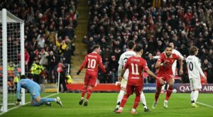 Liverpool’s Dutch striker #18 Cody Gakpo (2R) celebrates scoring the team’s second goal during the UEFA Champions League football match between Liverpool and Real Madrid at Anfield in Liverpool, north west England on November 27, 2024. (Photo by Oli SCARFF / AFP)