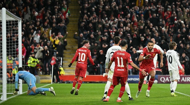 Liverpool’s Dutch striker #18 Cody Gakpo (2R) celebrates scoring the team’s second goal during the UEFA Champions League football match between Liverpool and Real Madrid at Anfield in Liverpool, north west England on November 27, 2024. (Photo by Oli SCARFF / AFP)