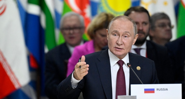 Russia’s President Vladimir Putin gestures as he speaks during the extended format meeting of the BRICS summit in Kazan on October 23, 2024. (Photo by Alexander NEMENOV / POOL / AFP)