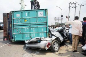 Containers fall on vehicle